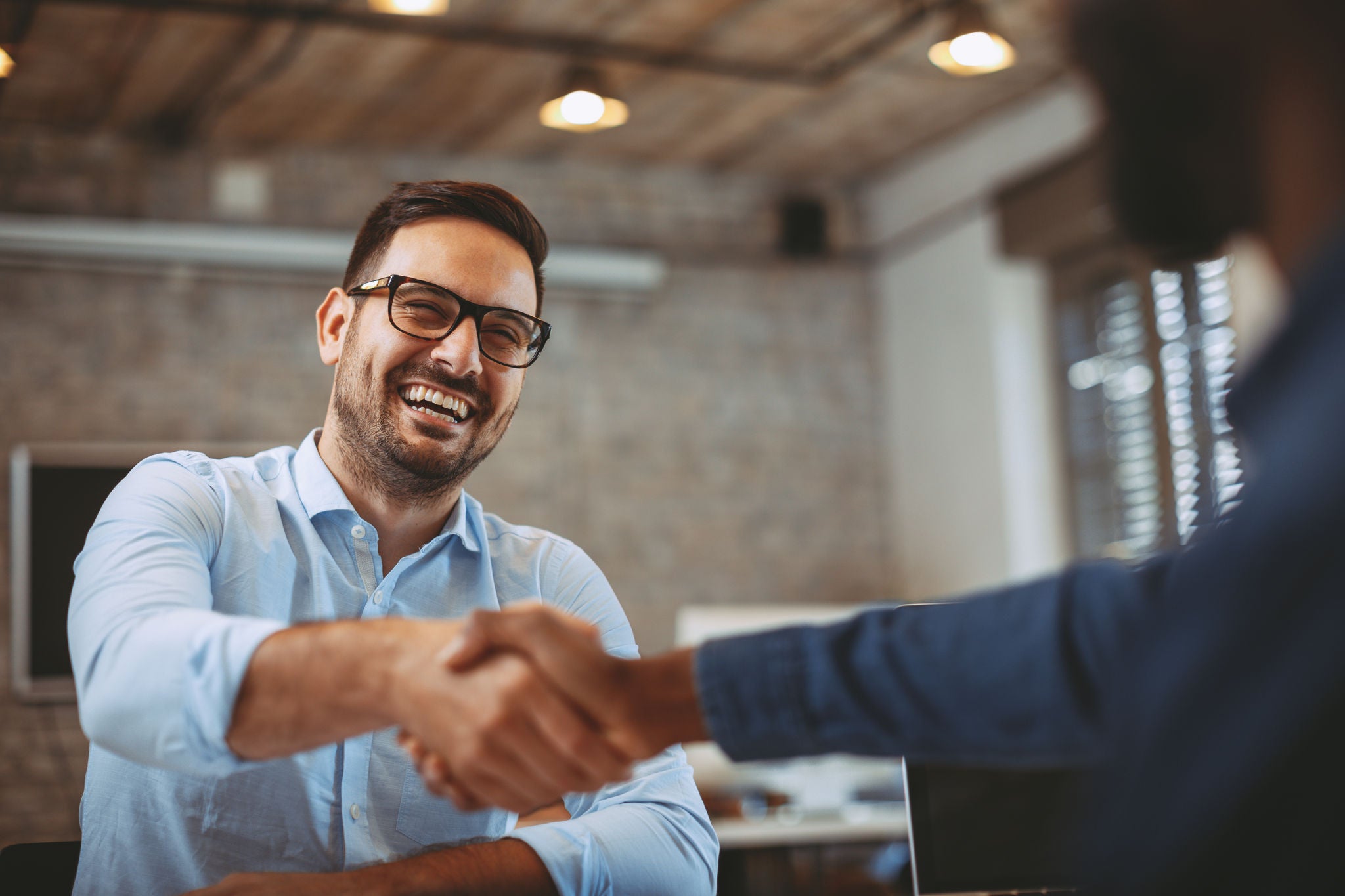 Close up of handshake in the office